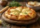 Pizza Quattro Formaggi s plneným okrajom a roztopeným syrom